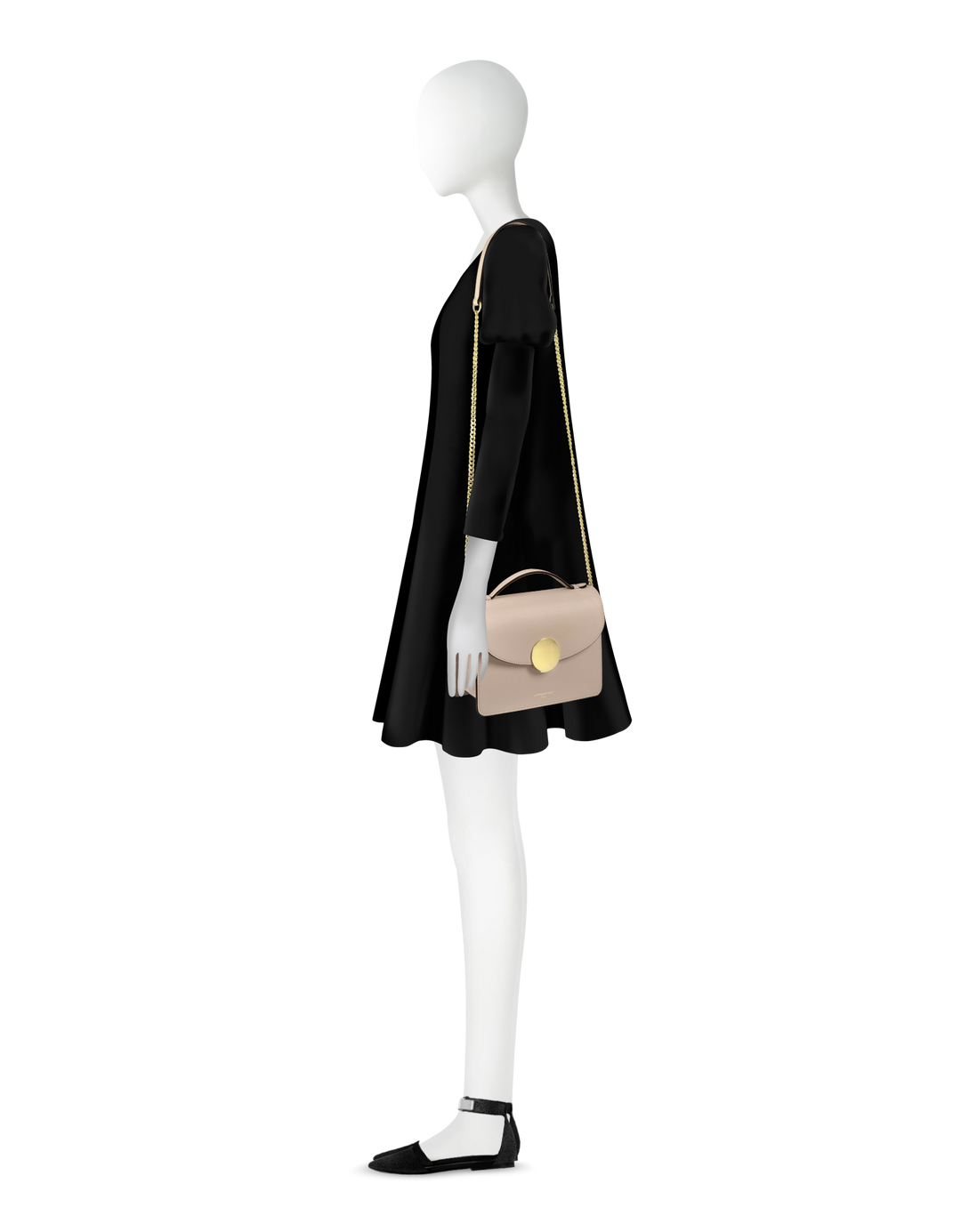 Side profile of a mannequin wearing a black dress with a beige crossbody bag and black shoes