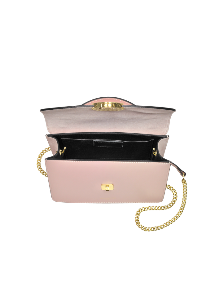 Pink leather handbag with gold chain strap and open top revealing black interior