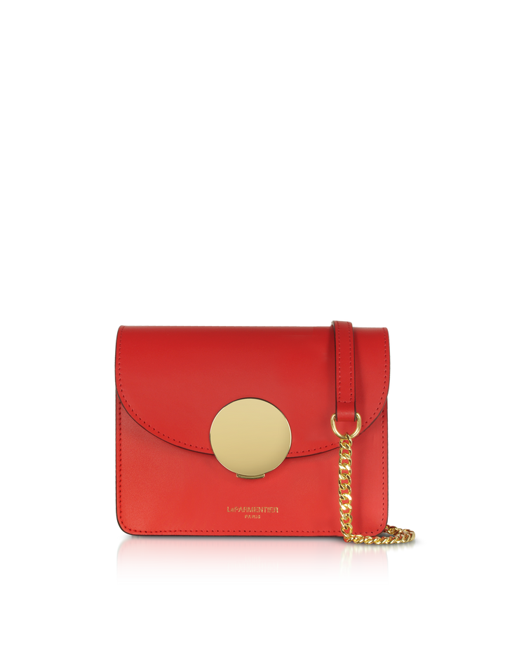 Red leather handbag with gold chain strap and circular gold clasp