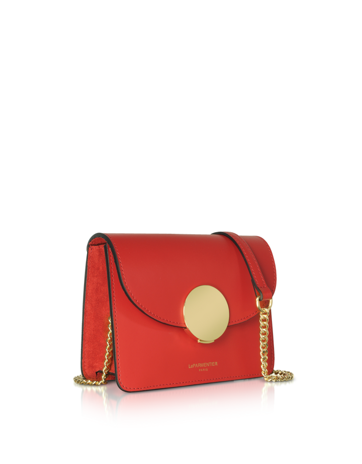 Red leather crossbody bag with gold circular clasp and chain strap