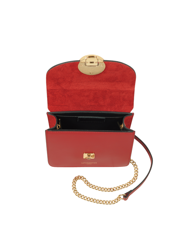 Stylish red leather handbag with gold chain strap and clasp