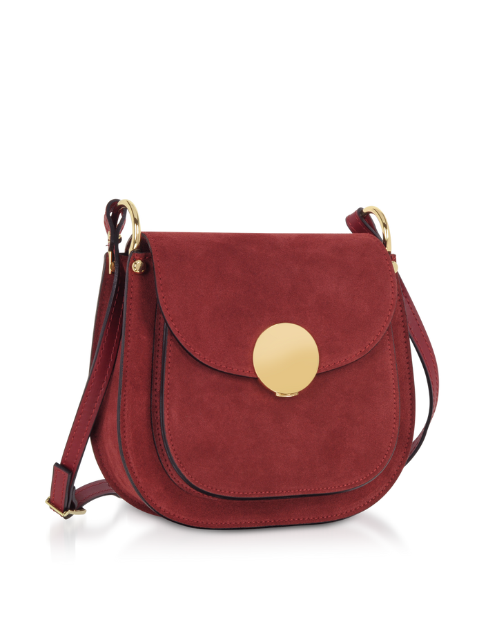 Red suede crossbody bag with a gold circular clasp and adjustable strap