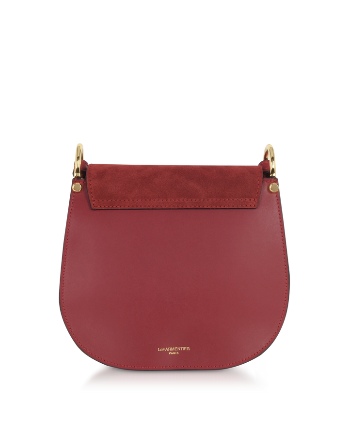 Red leather handbag with gold hardware and suede flap