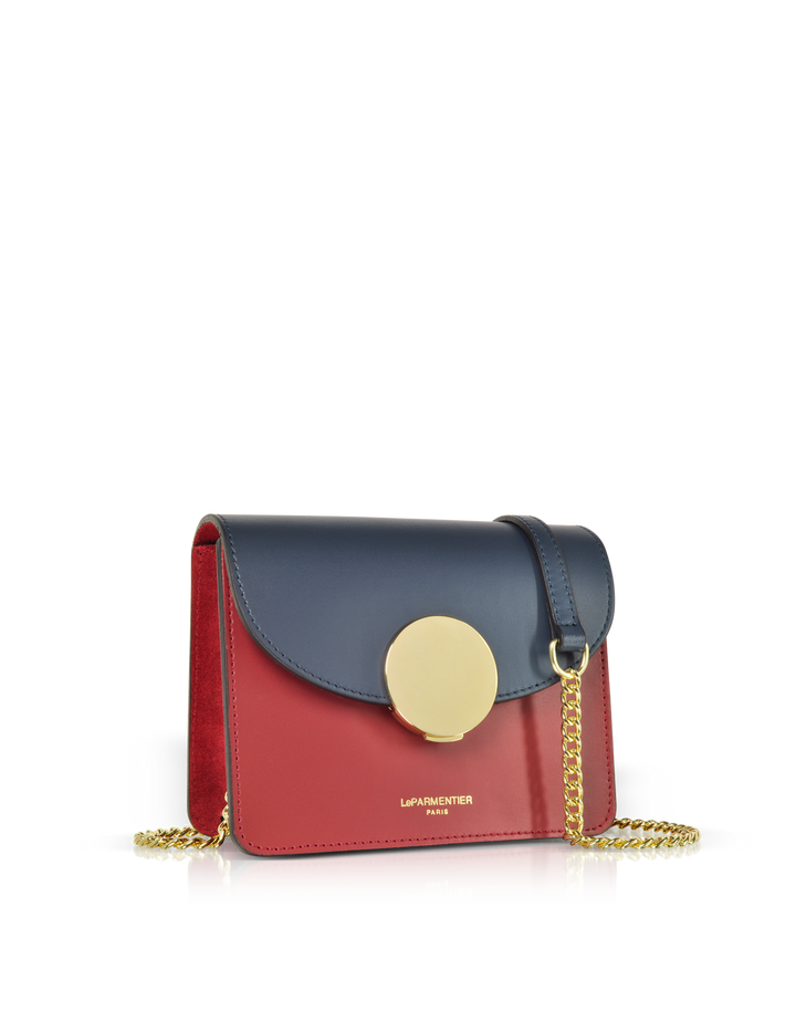 Red and blue leather handbag with gold chain strap and circular clasp