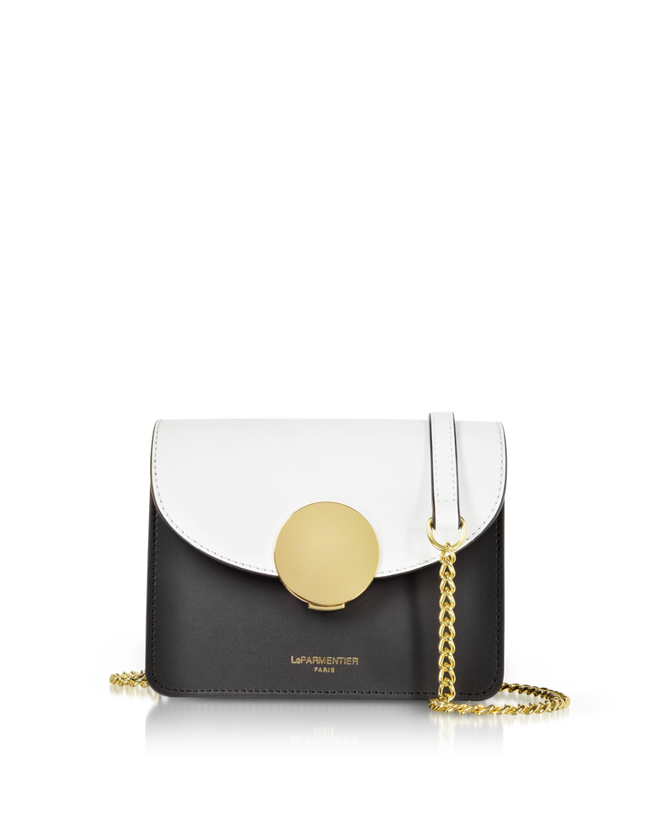 Black and white designer handbag with gold chain and round clasp