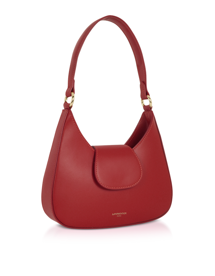 Red handbag with gold hardware and a structured handle against a white background