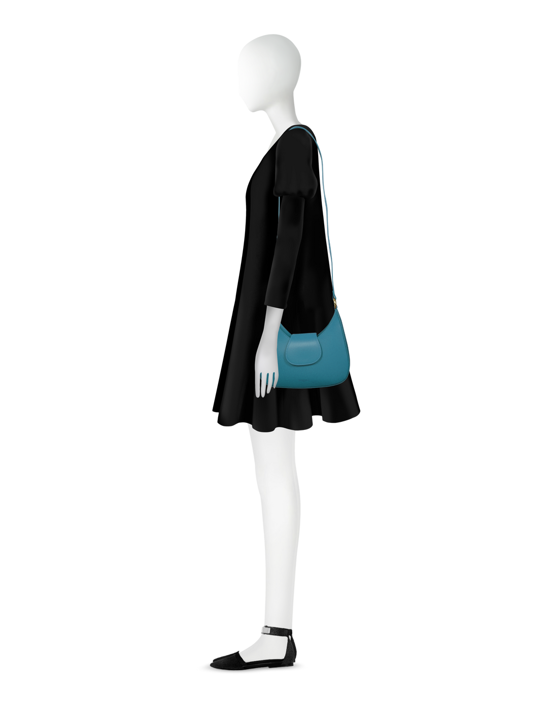 Woman in black dress with blue handbag