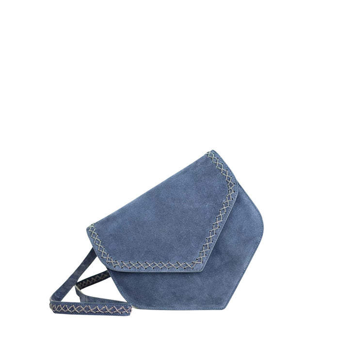 Blue suede crossbody bag with unique triangular flap and decorative stitching