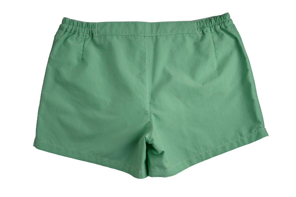 Green men's swim trunks with a subtle striped pattern
