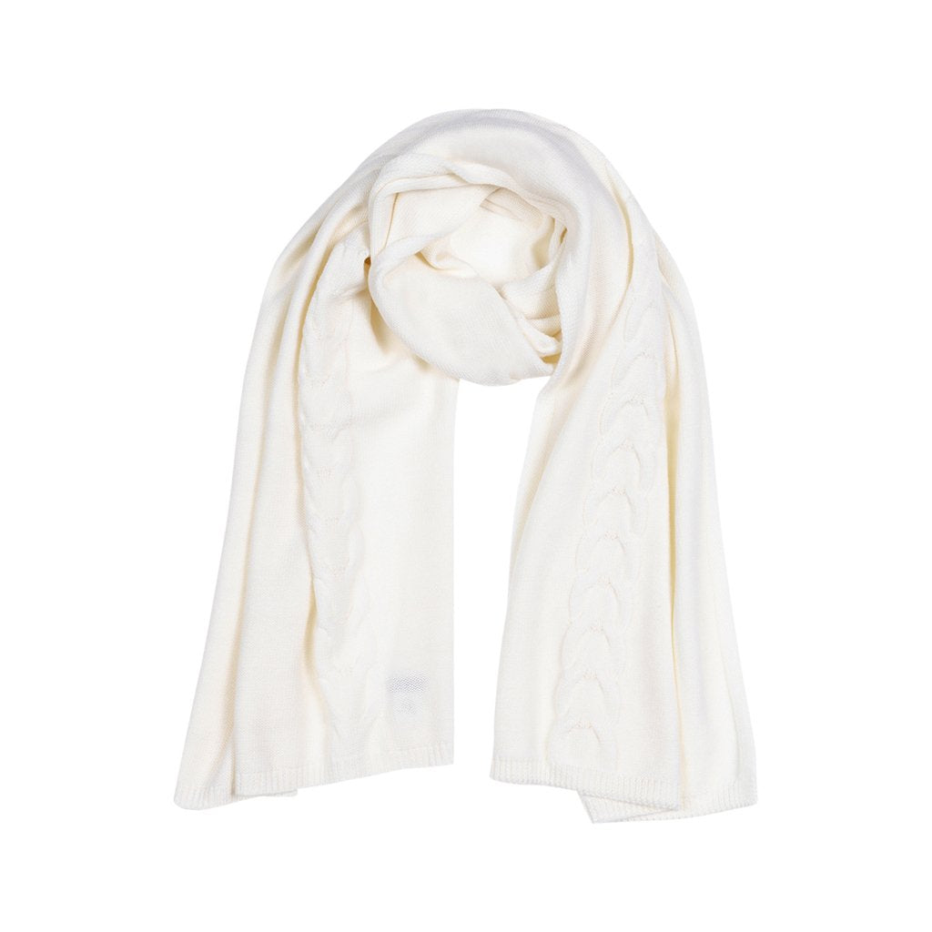 White knitted scarf neatly folded on a plain background