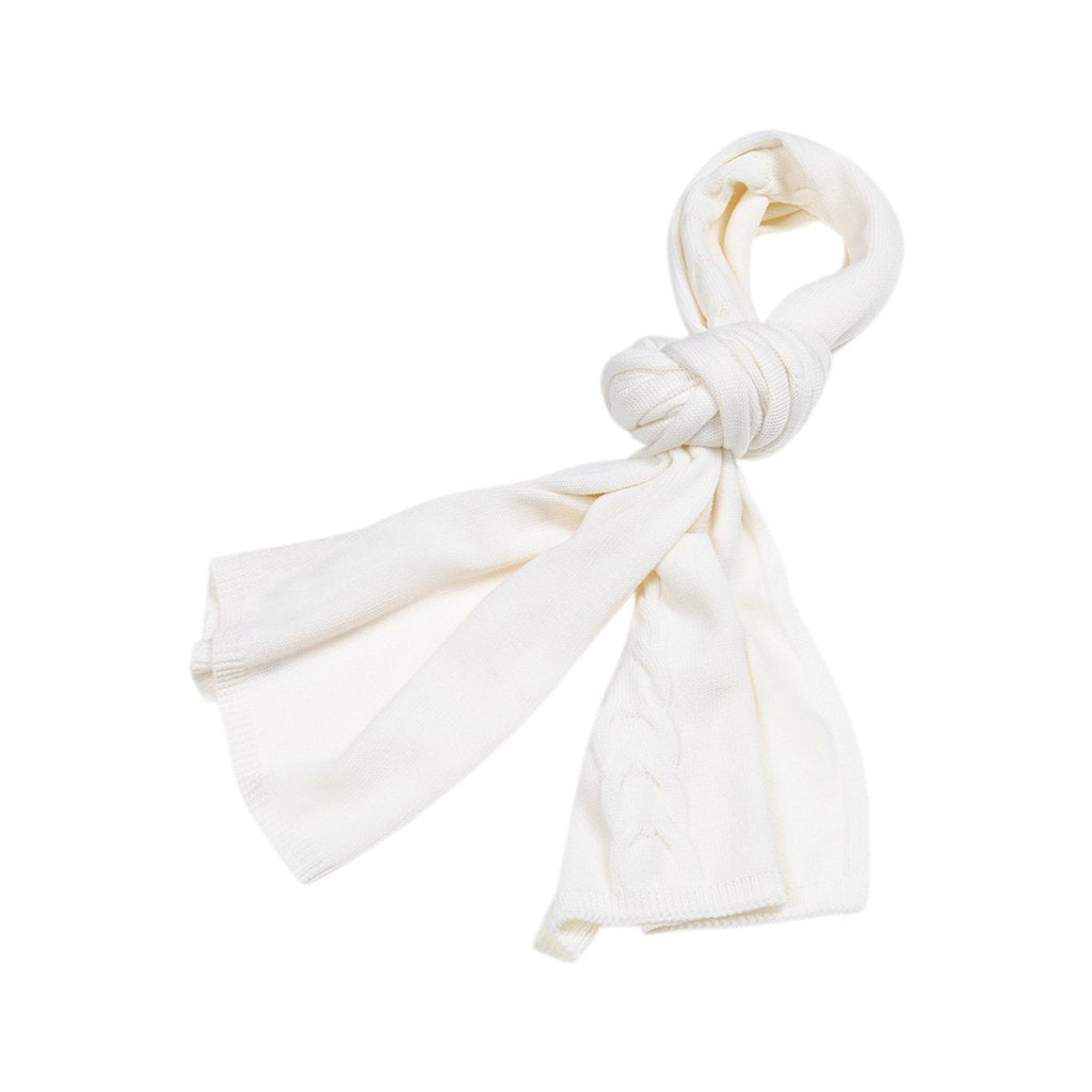 Cream-colored knitted scarf with a knot on a white background