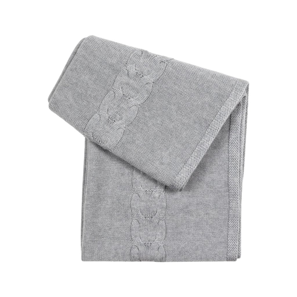 Gray textured blanket folded neatly showing intricate border design