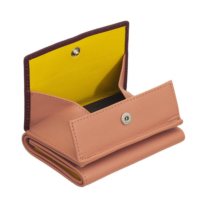 Open peach-colored leather wallet with yellow interior and snap closure