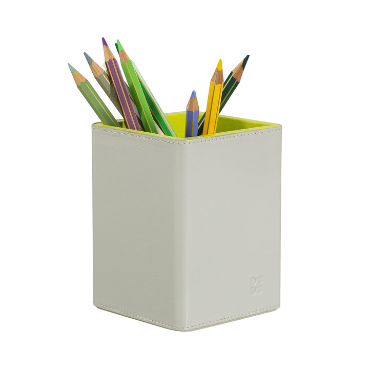 White pencil holder with colored pencils
