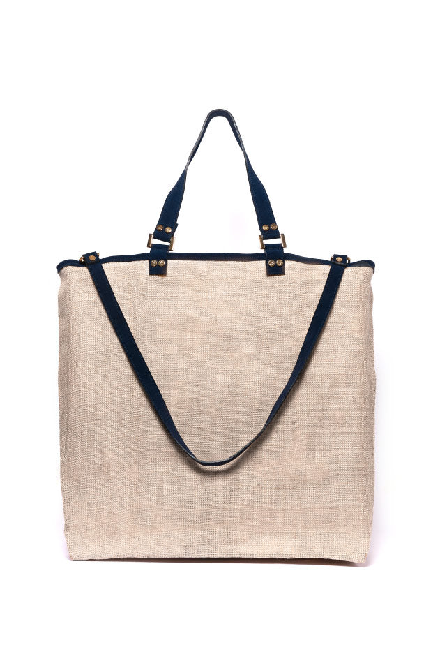 Beige jute tote bag with navy blue handles and straps