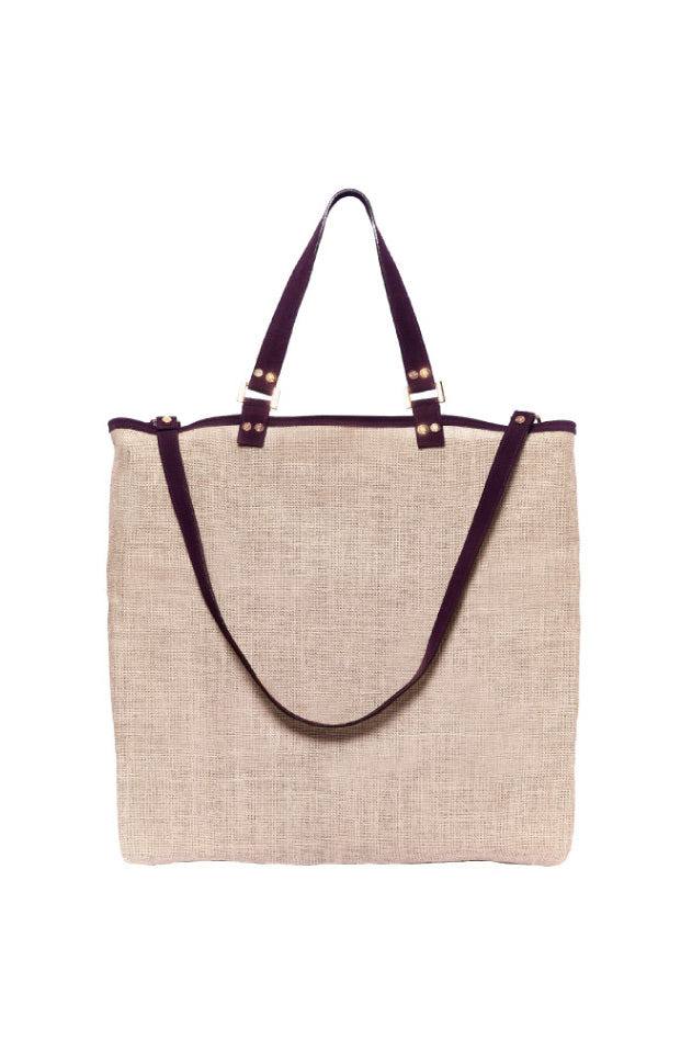 Beige jute tote bag with dark brown shoulder straps and handles on white background
