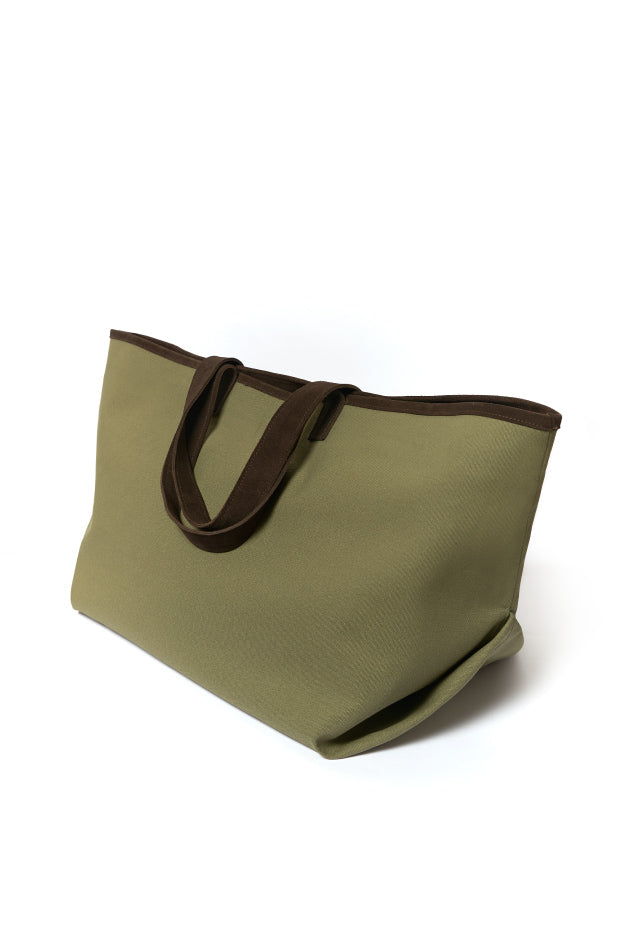 Olive green canvas tote bag with brown handles on white background