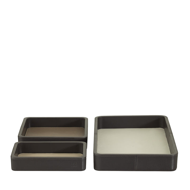 Set of three rectangular leather valet trays in varying sizes and neutral colors