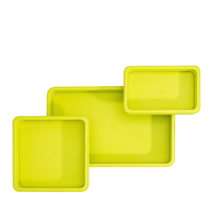 Set of three lime green leather trays in rectangular and square shapes