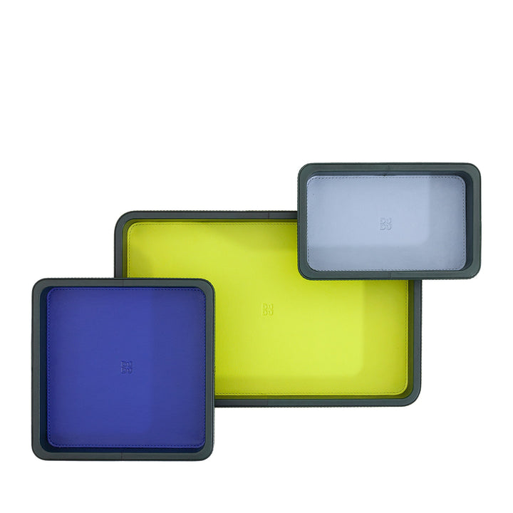Colorful square silicone baking mats in blue, yellow, and gray