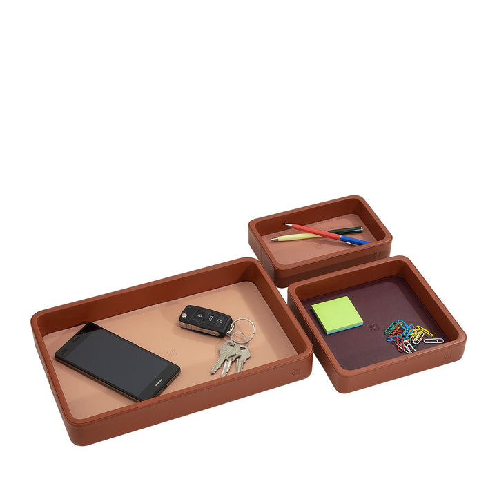 Desk organizer trays with phone, keys, and office supplies