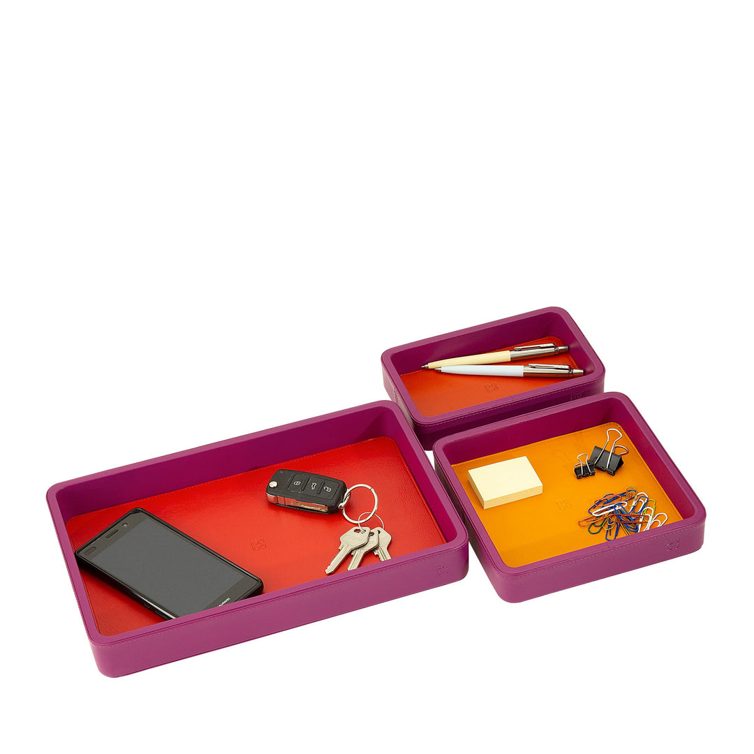 Colorful desk organizer trays with smartphone, keys, pens, binder clips, and sticky notes