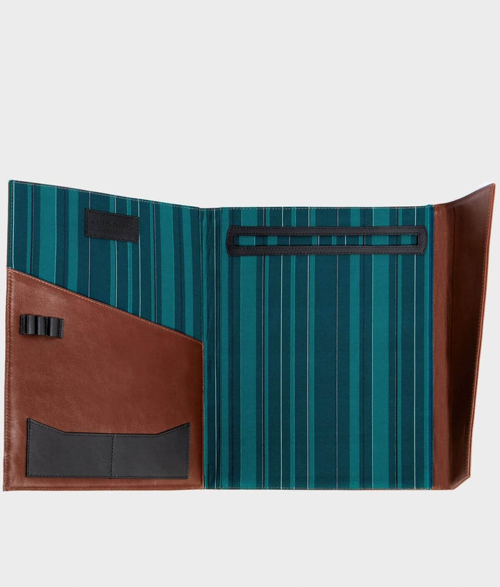 Open leather portfolio with teal and brown striped interior, featuring multiple pockets and pen holder