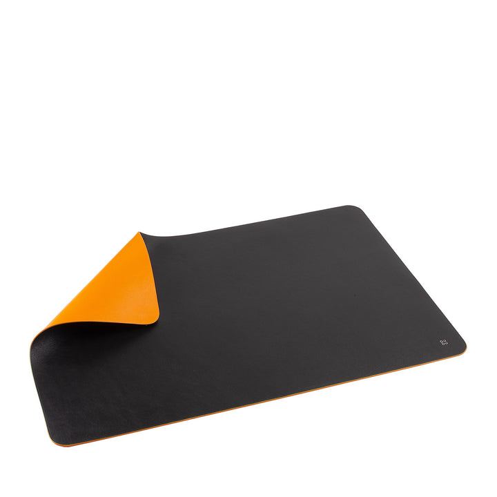 Black and orange reversible desk mat with curved edges