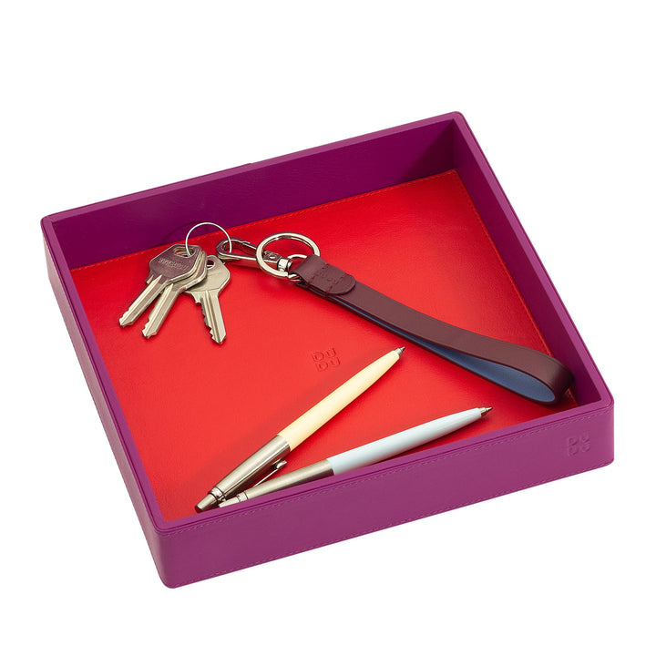 Purple leather valet tray with keys, pen, and red interior