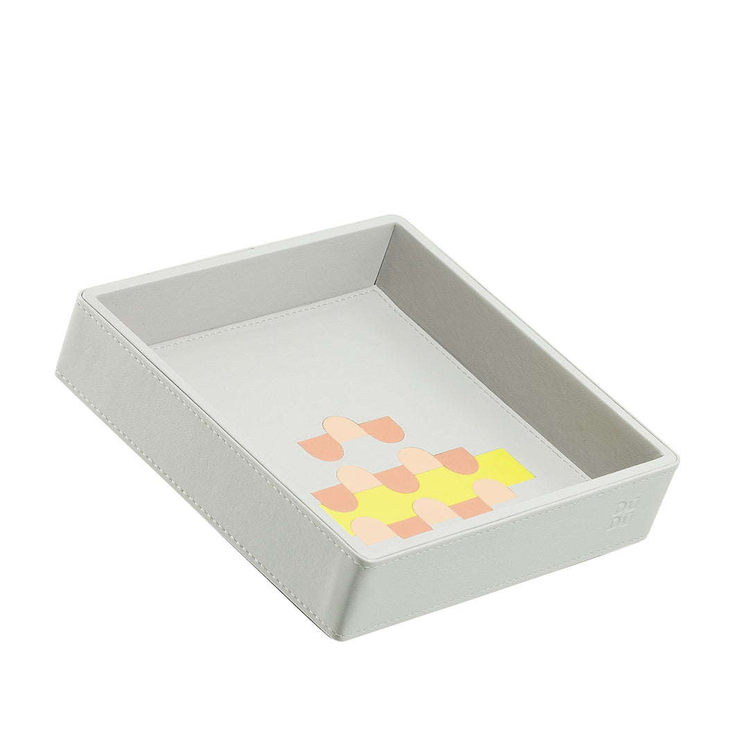 Rectangular white tray with colorful geometric design inside