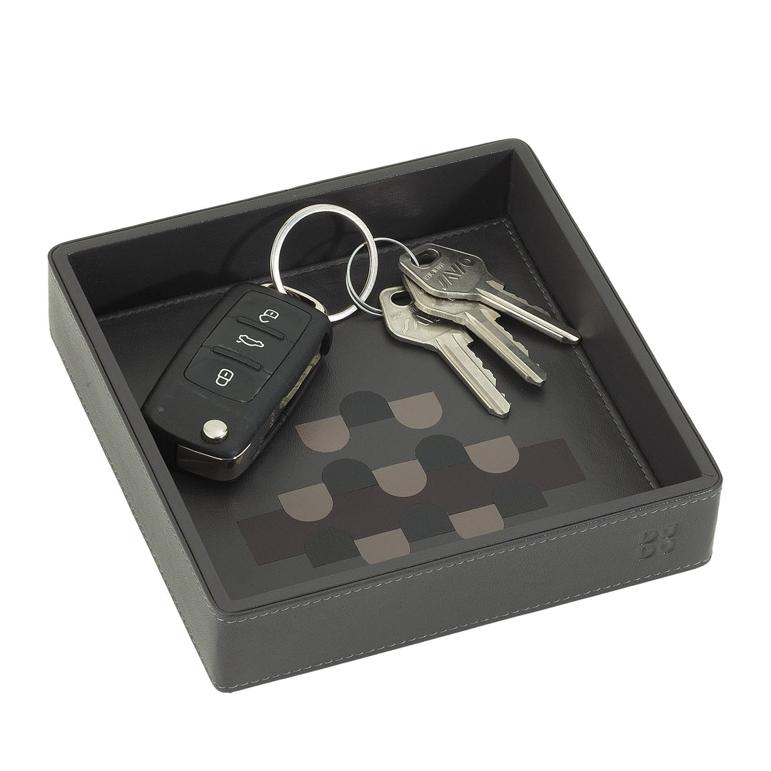 Black valet tray with car key fob and house keys