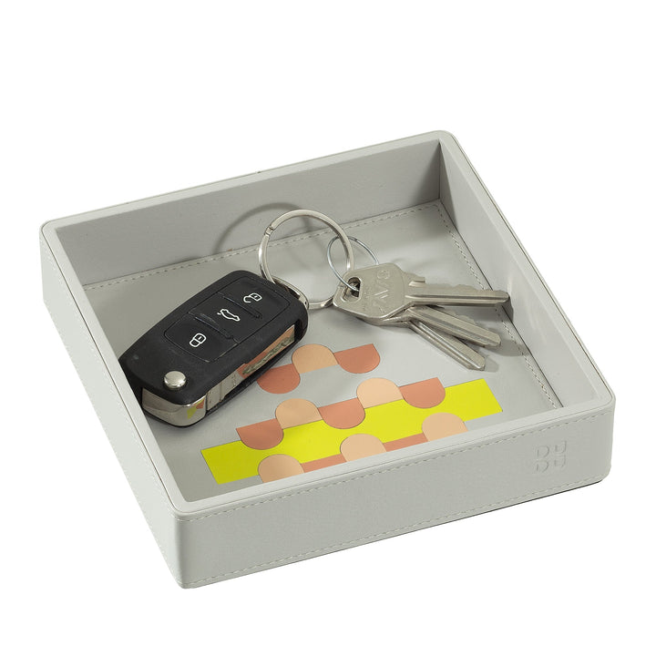 Gray valet tray with car keys and house keys