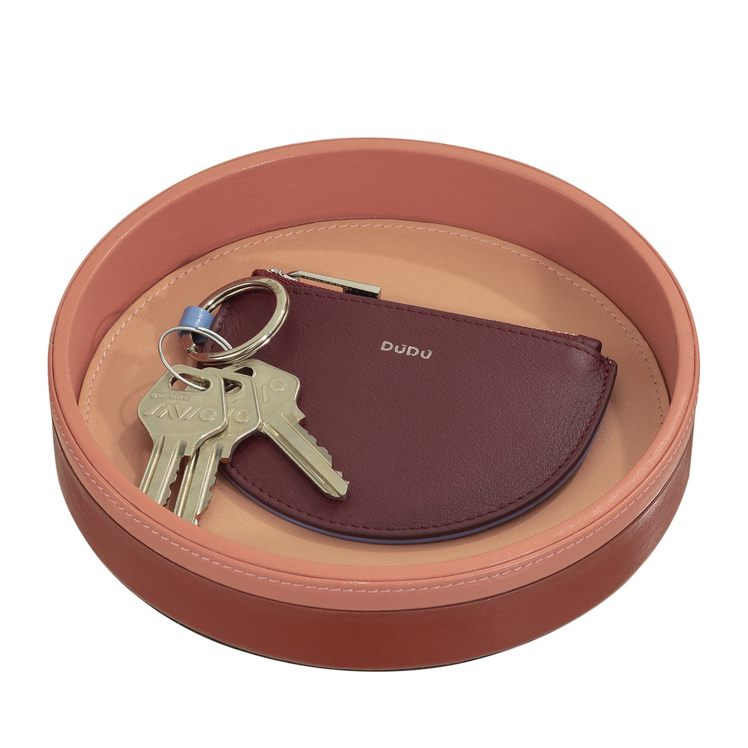 Round leather tray with keys and a maroon coin pouch