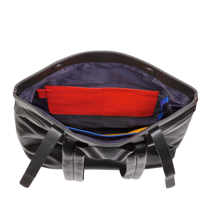 Interior view of a black leather tote bag with red and blue inner pockets