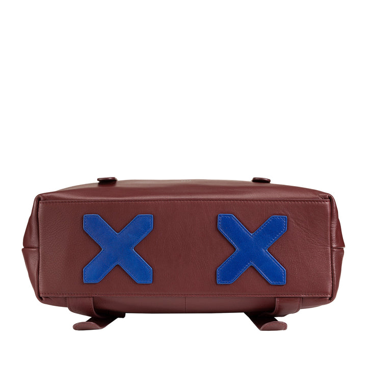 Brown leather bag with two blue X symbols on the base