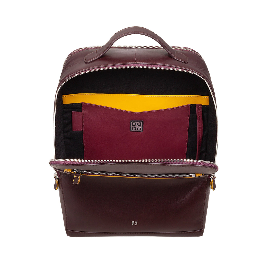 Open brown leather backpack with organized internal compartments