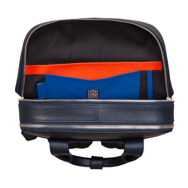 Open navy blue leather backpack with multiple compartments and colorful interior pockets