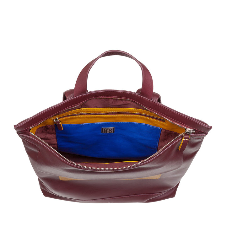 Burgundy leather handbag with open top revealing blue and yellow interior pockets