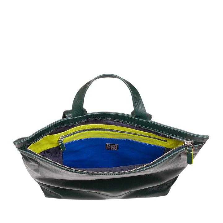 Green leather handbag with open compartments revealing blue and yellow fabric interior