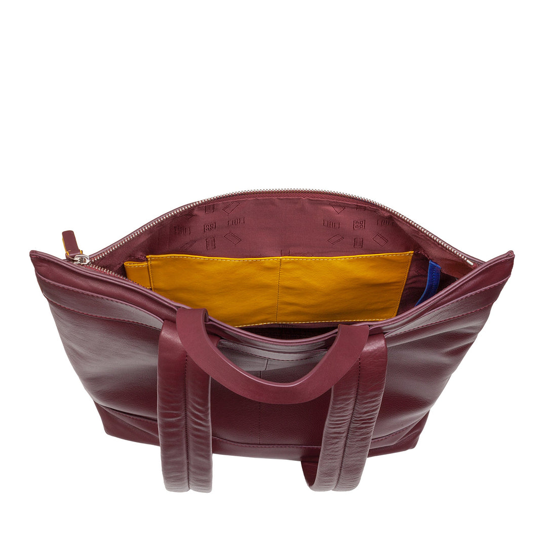 Maroon leather tote bag with yellow interior pocket and zip opening