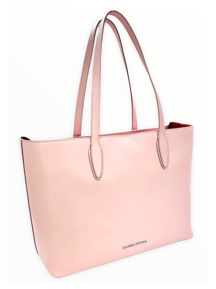 Pink leather tote bag with double handles and brand logo