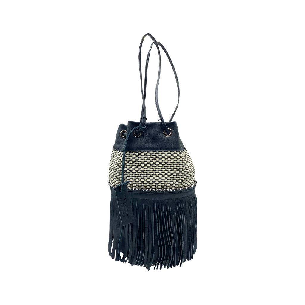 Black and white woven fringe bucket bag with leather straps