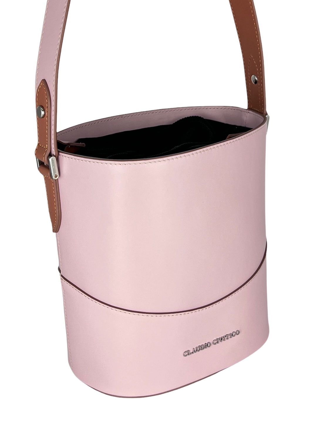 Pink designer handbag with brown leather strap and logo engraved on front