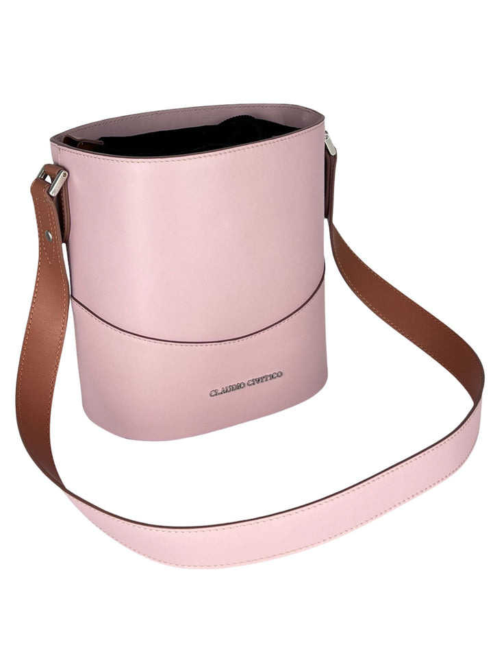 Pink leather bucket bag with brown adjustable shoulder strap