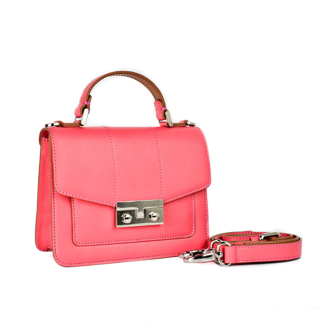 Pink leather handbag with top handle and detachable strap