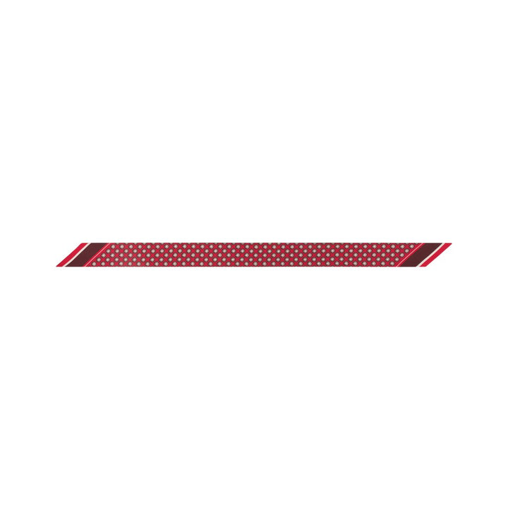 Red and gold polka dot decorative ribbon on white background