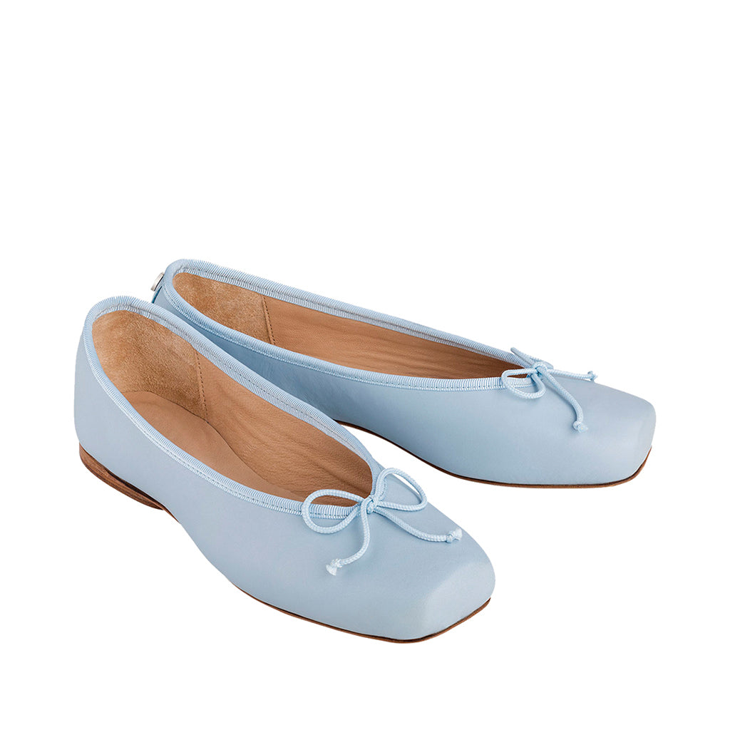 light blue leather ballet flats with bows on toes