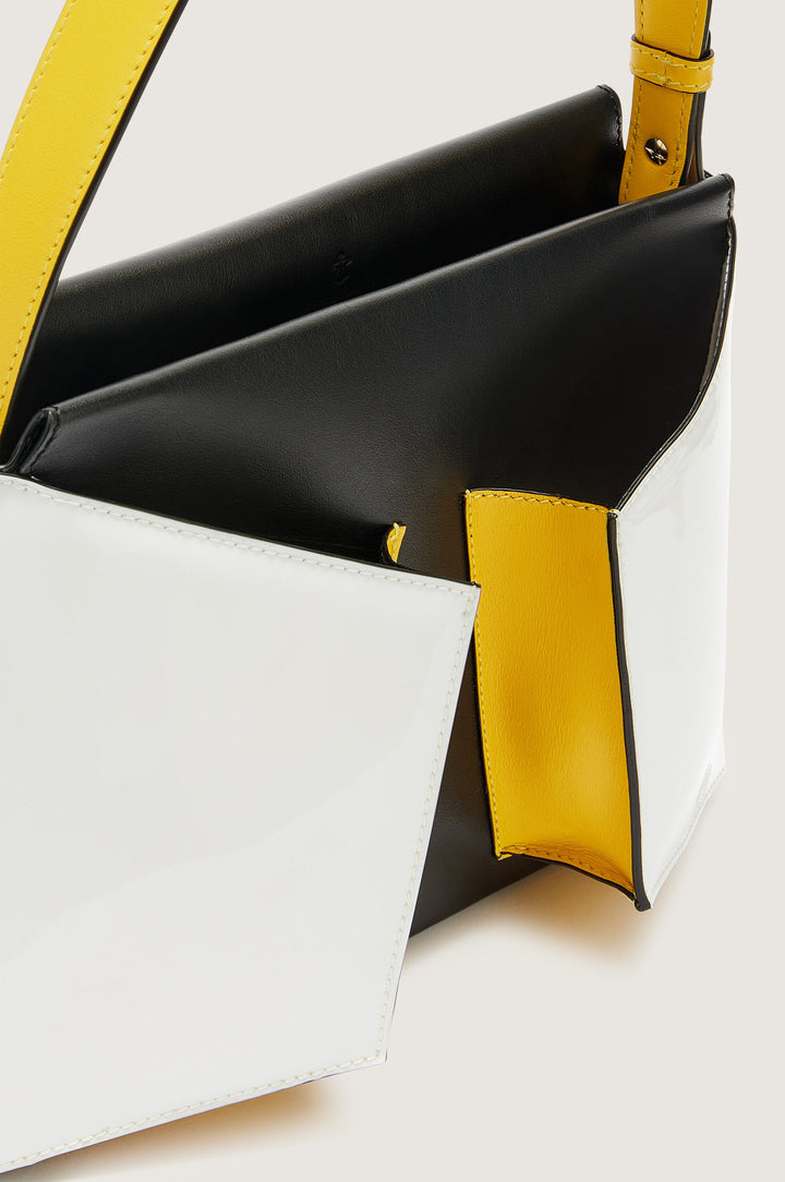 Modern black, white, and yellow leather handbag with sleek design