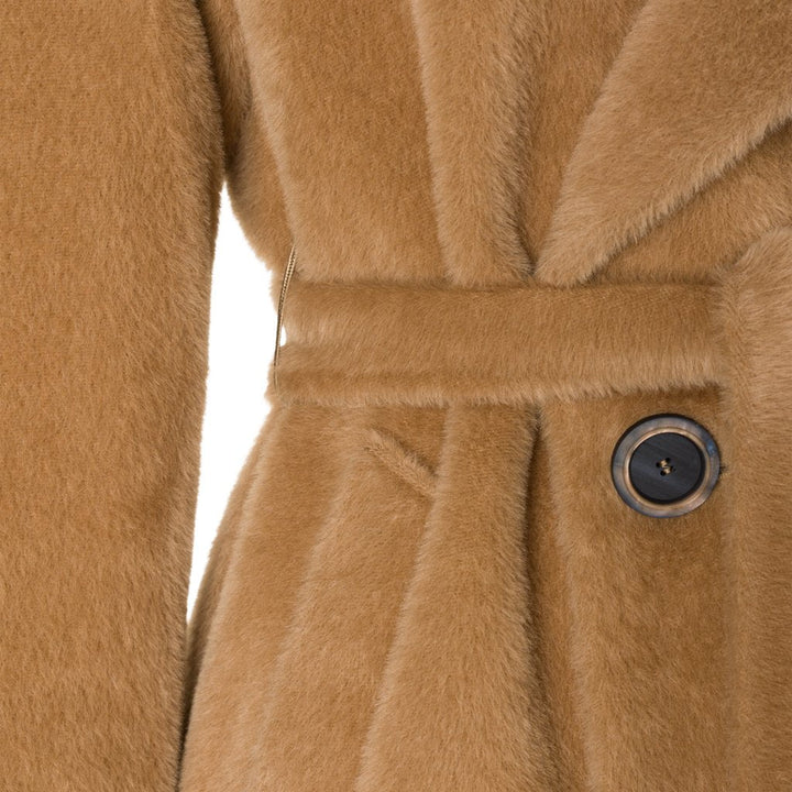 Close-up view of a luxurious camel-colored belted wool coat