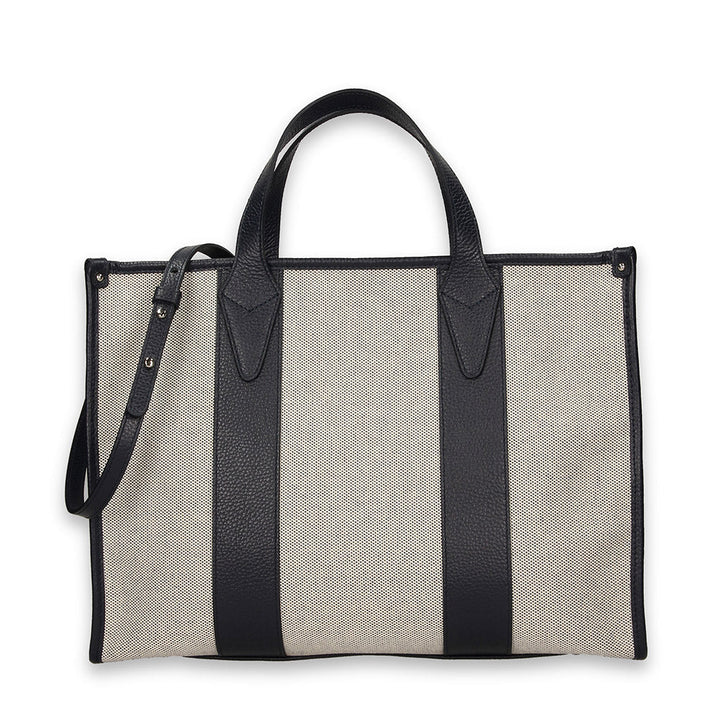 Mesh and leather tote handbag with adjustable strap on a white background